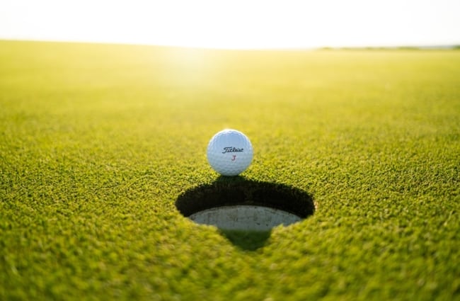 golf ball on green grass field during daytime